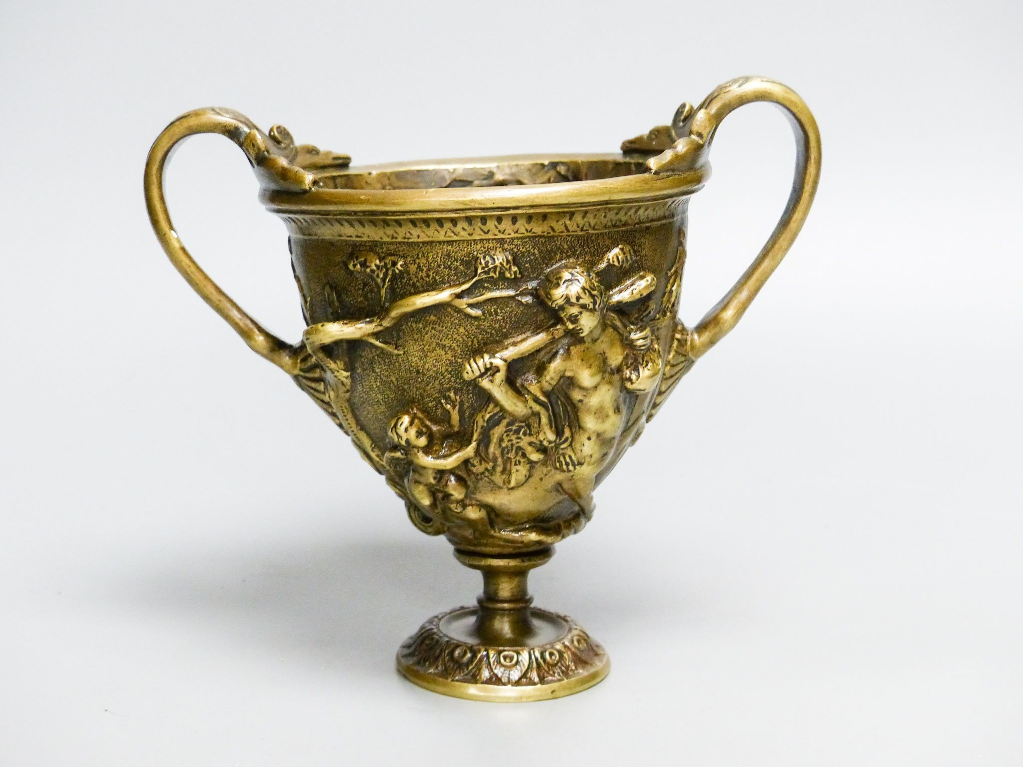 A Grand Tour style bronze cup after the Antique, 14.5 cm high